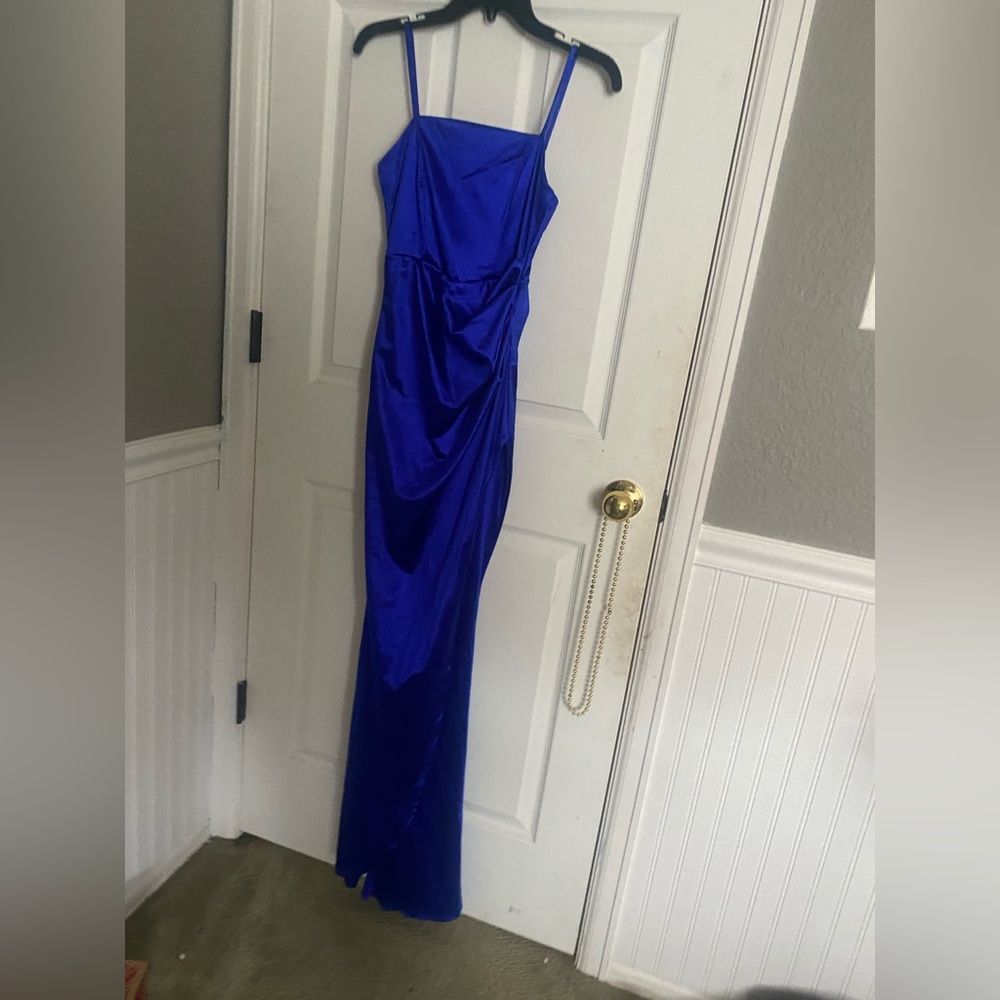 This dress is a royal blue prom dress or evening gown and it is a size xs